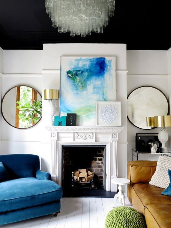 Good example of an eclectic interior with a white base color with blue as the connecting color