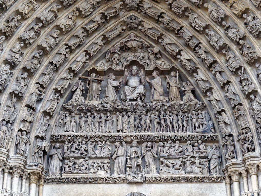 The tympanum of Notre Dame in Amiens with a richly decorated statue relief, 1270